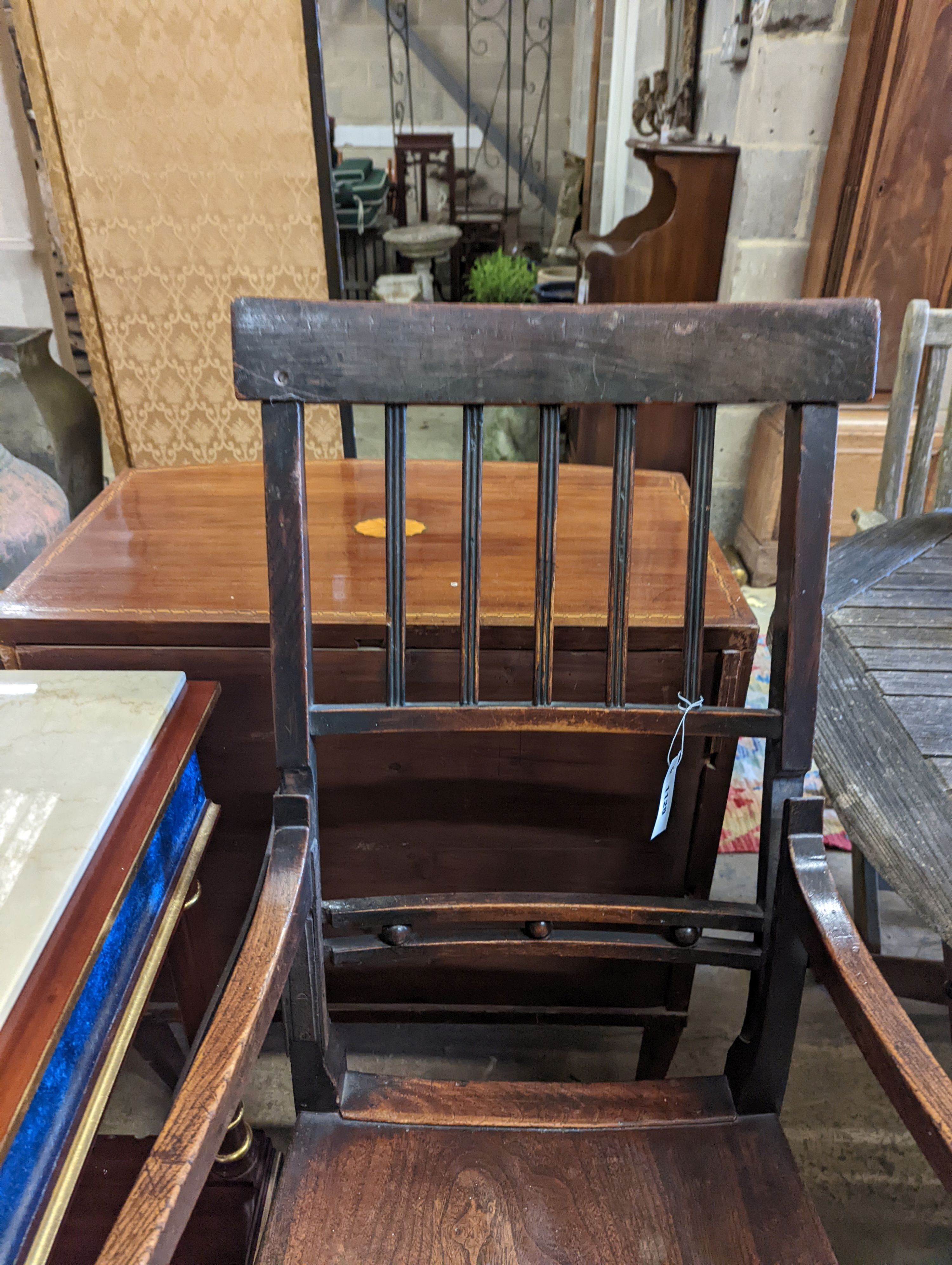 A Regency provincial ash and elm reclining wood seat elbow chair, width 54cm, depth 44cm, height 112cm